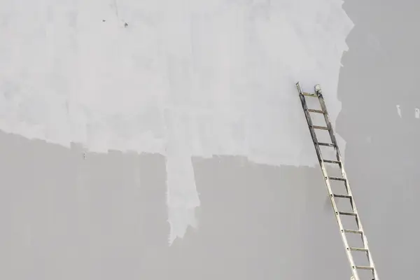 Exterior painting in Spokane: ladder against a freshly primed wall